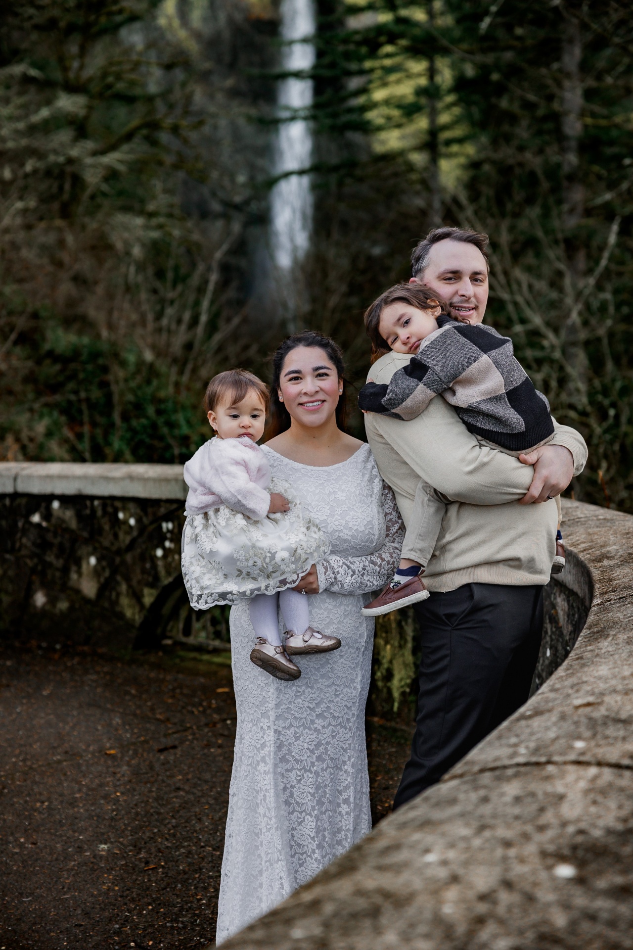Bella with her family at a Pacific Northwest waterfall